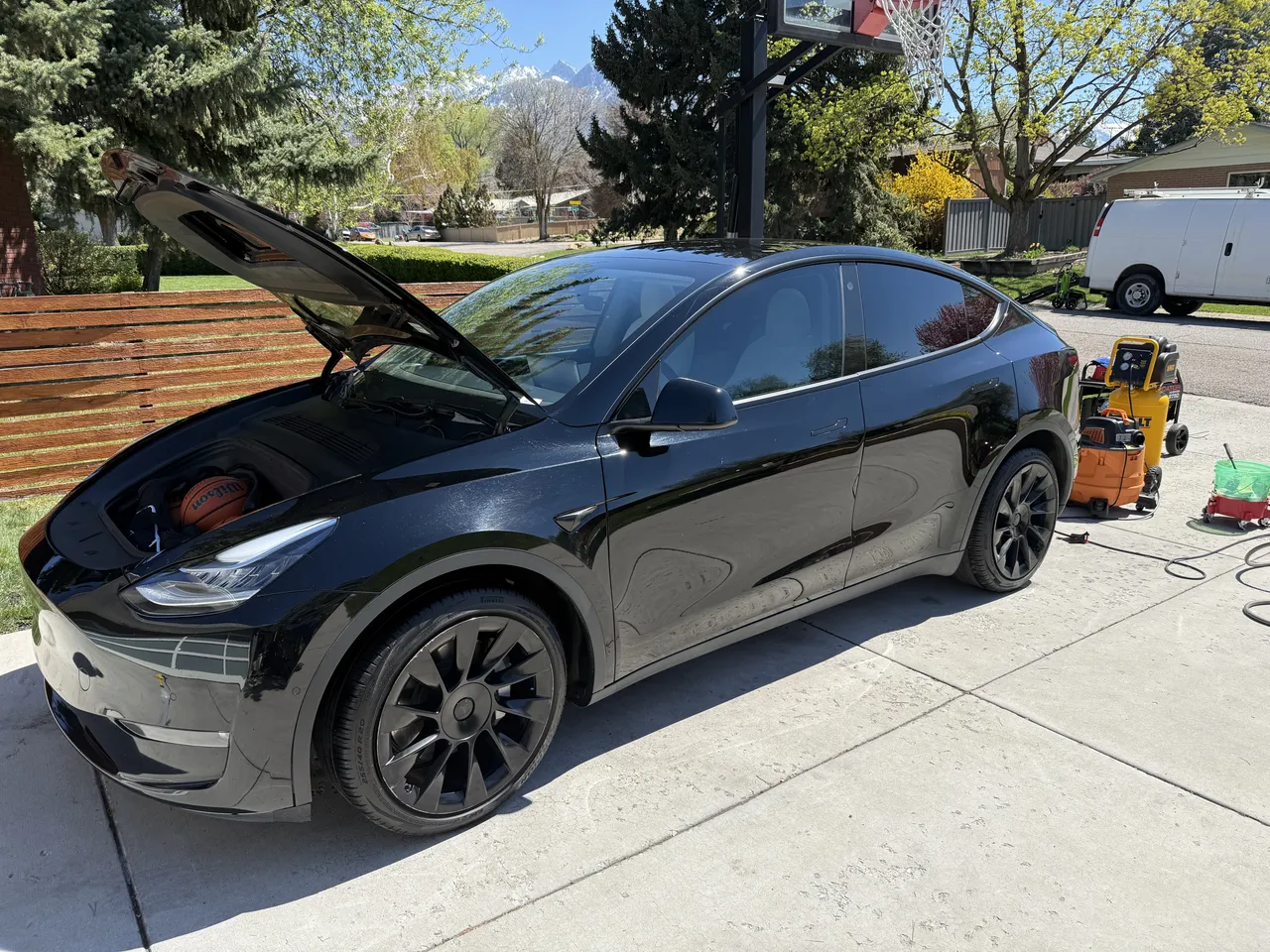 Black Tesla Model Y - Exterior plus interior detail in Sandy